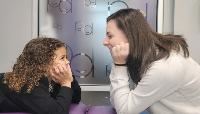 child smiling at dentist