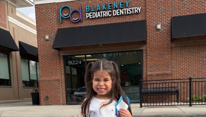 Happy child leaving dental office